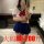 Curvy woman modeling plus size sexy lingerie set with uniform style, featuring red bow and blue skirt, ideal for busty & peti...