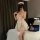 Sexy maid costume featuring a checkered backless dress with a flirty petticoat, perfect for plus-size women seeking playful e...