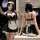 A woman poses in a maid-themed lingerie set featuring a black and white design with lace details, perfect for adult entertain...