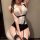 Woman wearing pure & playful lingerie set - seductive secretary style sleepwear with white blouse, black garter belt, and sto...