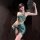 Elegant green halter top with floral embroidery and fringe detail, paired with a matching wrap skirt, perfect for a playful y...