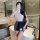 Woman in white lace top and gray secretary skirt holding a folder, showcasing the pure & seductive lingerie set.
