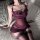 Woman wearing purple lace-trimmed bodysuit and matching thigh-highs on bed — pure & seductive lingerie set, plus size bodycon...