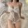 Woman wearing white lace lingerie set with bow details, seated on fluffy rug. pure & seductive lingerie set - sexy sleepwear ...