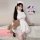 A person wearing a white nurse costume set, featuring lace details, high-slit design, and summer-ready white mesh fabric, hol...