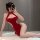A woman poses seductively in a red lace dress inspired by traditional chinese attire, featuring an open back and split design...