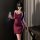 Elegant burgundy dress with halter neck and lace mask, perfect for evening elegance and allure.