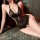 Woman wearing purple lace mesh sleep dress with open-crotch design, sheer fabric and floral trim, seductive nightwear set.