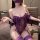 Woman wearing purple lace corset bodysuit with fishbone shapewear, sheer straps, and matching thigh-highs in seductive unifor...