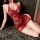 Vivid red lace sleep dress with floral patterns, featuring a deep neckline and tie detail. ideal for playful nightwear, offer...