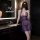 Woman in purple sheer lingerie set with deep v neck, posing in modern bathroom. seductive no-remove outfit for curvy women.