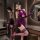 A woman poses confidently wearing a purple velvet lace-up sensual cheongsam nightgown, perfect for sexy bedtime or club outfi...