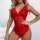 Woman modeling red lace deep v-neck bodysuit lingerie set with sheer floral detailing and scalloped edges.