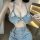 Woman wearing qingruohan sexy denim lingerie set with cutout bra and short panty for bedroom play and roleplay.