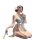 Woman kneeling in elegant qingshe lingerie set with sheer sleeves, butterfly hair accessory, and fan.