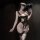 Woman in qingshe lingerie set with underwire bra and sheer stockings, holding a feathered accessory.