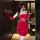 A woman poses confidently wearing a qingshe red velvet sexy new year outfit, featuring a sheer lace bodycon dress with a spar...