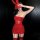 Woman in red lace bunny lingerie set with crop top, mini dress, and matching stockings for cosplay or holiday parties.