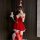 Sexy low-cut red christmas dress with festive hat and stockings, perfect holiday costume.