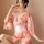 A woman poses elegantly in a retro japanese kimono-style lingerie set, featuring vibrant floral patterns, delicate lace bodys...
