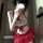 A woman poses in a red and white new schoolgirl jk uniform lingerie set, featuring lace details and a bow, perfect for seduct...