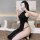Seductive black cheongsam sleepwear featuring a side slit and open-crotch design, perfect for women seeking elegant yet darin...