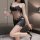 Woman in black lace bodysuit with open crotch, holding wine glass, perfect for date night lingerie.