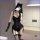 Woman modeling black lace lingerie set with sheer mesh bodysuit, garter stockings, and cat ears.