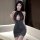 Woman wearing a black lace and glittery seductive maid costume lingerie set, featuring a no-remove design for modest yet temp...