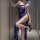 Woman in blue lace lingerie set with high slit, featuring delicate straps and elegant design for seductive yet modest nightwe...