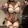 Woman wearing a sensual leopard print lingerie set with matching gloves and stockings, featuring a seductive uniform style de...
