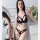 Sexy black lace bondage lingerie set featuring a provocative cut-out bra and thong outfit with patent leather accents, perfec...