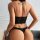 Sexy lace bodysuit with cut-out design and ties, offering sheer allure and feminine appeal.