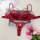 Red lace embroidery lingerie set with bra and thong, elegant design for women, displayed on gray fabric with pink flowers nea...