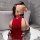 Woman wearing backless red lace sleepwear with cutout cheongsam-style design, kneeling in bathroom.