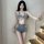 Woman wearing sexy lace-trimmed denim short set, seductive no-remove bedroom outfit with cut-out details and frayed edges.