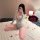 Woman in gray padded yoga bra and open-crotch lingerie set, posing on bed with rose petals—sexy office-themed outfit for conf...
