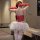 Woman in red lace nurse costume with white tutu and gloves, perfect for halloween, cosplay, or boudoir photos.