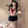 Sexy schoolgirl costume set featuring a short navy skirt, sailor top with red bow, perfect for adults seeking pure and tempti...