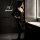 Woman wearing a sexy sheer open-crotch bodysuit in a modern bathroom, showcasing the transparent lingerie outfit’s seductive ...