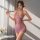 A woman poses elegantly in a sheer mesh dress featuring vintage-inspired lace details, perfect for seductive sleepwear or bod...
