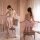 Suoqing vintage sheer lingerie set featuring pearl-embellished belly dance bra and tassel skirt, exuding exotic elegance.