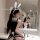 Woman in tangdao sensual lingerie set, a modest yet seductive uniform-style sleepwear with bunny ears, posing in a bathroom.