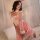 A woman poses in a pink xintao christmas lingerie set, featuring red velvet sleep dress with ruffles and bows, perfect for ne...