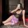 A woman poses seductively wearing a yese yese sexy lace bodycon dress, featuring intricate lace details and a silky pink skir...