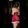 Sexy red velvet slip dress with white fur trim, featuring side slit and sheer mesh details, perfect for festive occasions.