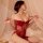 Woman wearing red yue die sexy lace sleepwear set with cut-out cami and matching robe, posing seductively on bed.