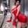 Woman in red lace yuedie rose temptation qipao lingerie, posing seductively with gloves and mask on marble counter.