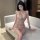 Woman wearing yuedie sexy lingerie set, deep v sparkle nightwear with shiny sequins, alluring adult intimate apparel.