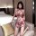 A woman poses elegantly in an ancient chinese style sheer lace erotic sleepwear set, featuring intricate embroidery and a del...
